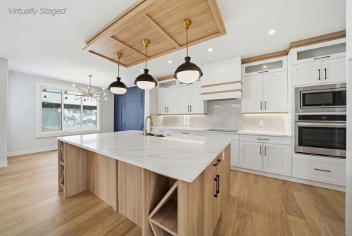 2005 Waterbury Road, Chestermere, AB - Indoor Photo Showing Kitchen With Upgraded Kitchen