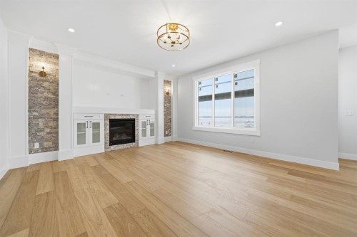2005 Waterbury Road, Chestermere, AB - Indoor Photo Showing Living Room With Fireplace