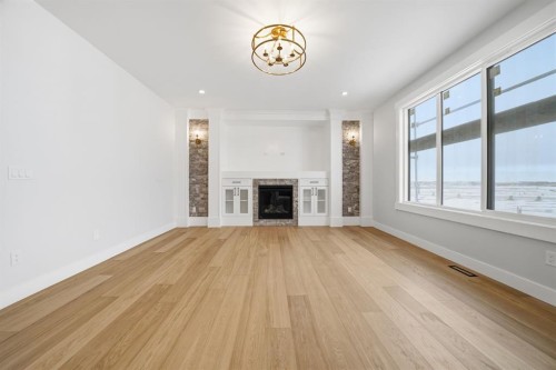 2005 Waterbury Road, Chestermere, AB - Indoor Photo Showing Other Room With Fireplace
