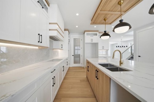 2005 Waterbury Road, Chestermere, AB - Indoor Photo Showing Kitchen With Double Sink With Upgraded Kitchen