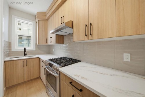 2005 Waterbury Road, Chestermere, AB - Indoor Photo Showing Kitchen With Double Sink