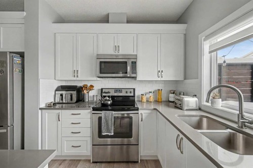 38 Sage Bluff Gate Nw, Calgary, AB - Indoor Photo Showing Kitchen With Double Sink