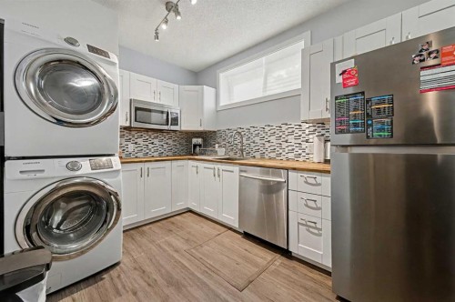 38 Sage Bluff Gate Nw, Calgary, AB - Indoor Photo Showing Laundry Room