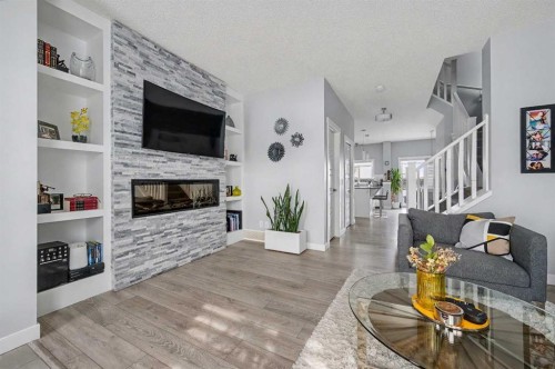 38 Sage Bluff Gate Nw, Calgary, AB - Indoor Photo Showing Living Room With Fireplace