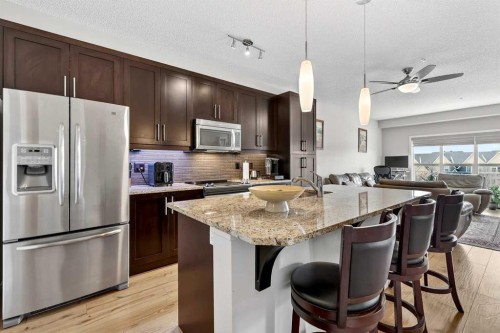 308-402 Marquis Lane Se, Calgary, AB - Indoor Photo Showing Kitchen With Stainless Steel Kitchen With Upgraded Kitchen