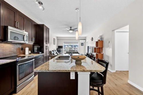 308-402 Marquis Lane Se, Calgary, AB - Indoor Photo Showing Kitchen With Double Sink With Upgraded Kitchen