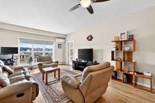 308-402 Marquis Lane Se, Calgary, AB - Indoor Photo Showing Living Room