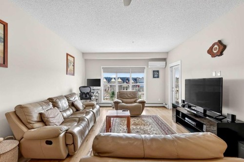 308-402 Marquis Lane Se, Calgary, AB - Indoor Photo Showing Living Room