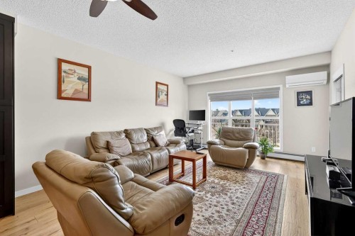 308-402 Marquis Lane Se, Calgary, AB - Indoor Photo Showing Living Room