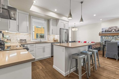 201G-1101 Three Sisters Parkway, Canmore, AB - Indoor Photo Showing Kitchen With Stainless Steel Kitchen With Upgraded Kitchen