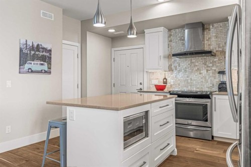 201G-1101 Three Sisters Parkway, Canmore, AB - Indoor Photo Showing Kitchen With Stainless Steel Kitchen With Upgraded Kitchen