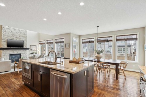 200 Aspen Summit View Sw, Calgary, AB - Indoor Photo Showing Kitchen With Fireplace With Double Sink With Upgraded Kitchen