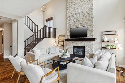 200 Aspen Summit View Sw, Calgary, AB - Indoor Photo Showing Living Room With Fireplace