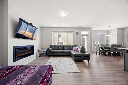 93 Cityline Square Ne, Calgary, AB - Indoor Photo Showing Living Room With Fireplace