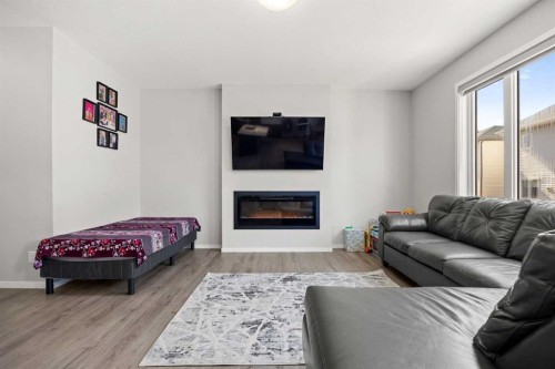 93 Cityline Square Ne, Calgary, AB - Indoor Photo Showing Living Room With Fireplace