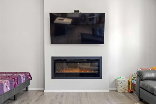 93 Cityline Square Ne, Calgary, AB - Indoor Photo Showing Living Room With Fireplace