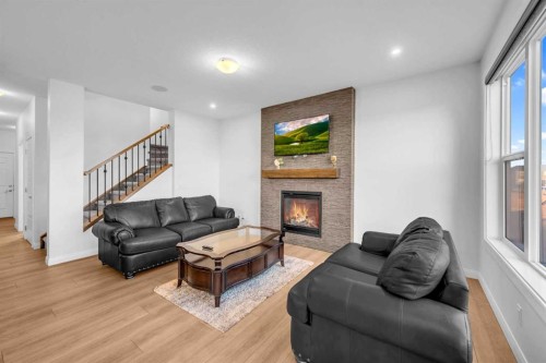 628 West Lakeview Drive, Chestermere, AB - Indoor Photo Showing Living Room With Fireplace