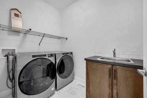628 West Lakeview Drive, Chestermere, AB - Indoor Photo Showing Laundry Room