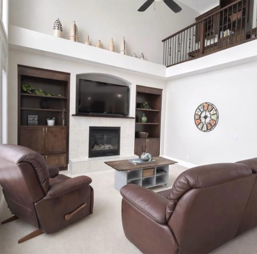 86 Muirfield Boulevard, Lyalta, AB - Indoor Photo Showing Living Room With Fireplace