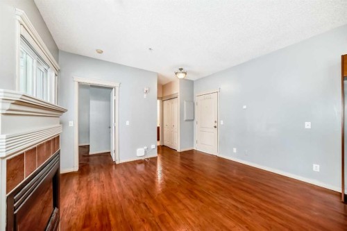 163-333 Riverfront Avenue, Calgary, AB - Indoor Photo Showing Other Room With Fireplace