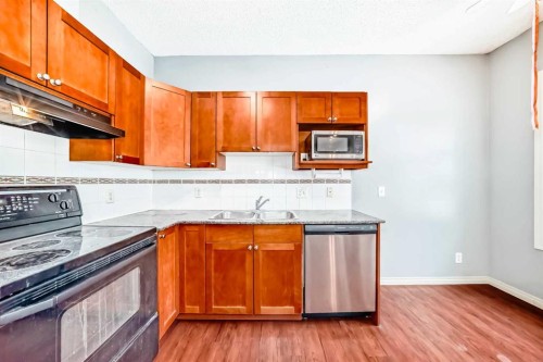 163-333 Riverfront Avenue, Calgary, AB - Indoor Photo Showing Kitchen With Double Sink