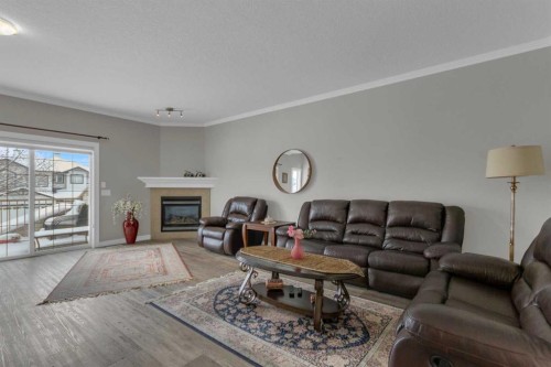 10 West Cedar Rise Sw, Calgary, AB - Indoor Photo Showing Living Room With Fireplace