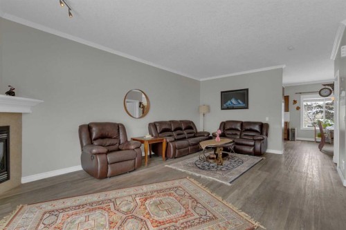 10 West Cedar Rise Sw, Calgary, AB - Indoor Photo Showing Living Room With Fireplace