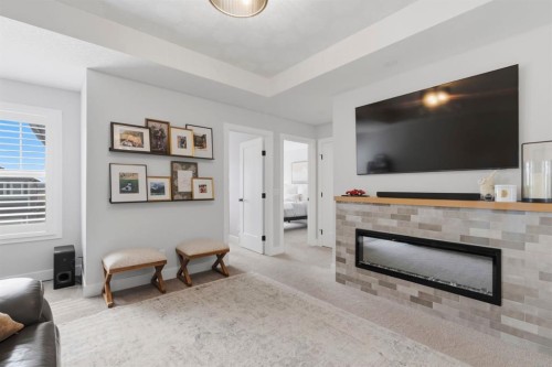 743 Seton Circle Se, Calgary, AB - Indoor Photo Showing Living Room With Fireplace