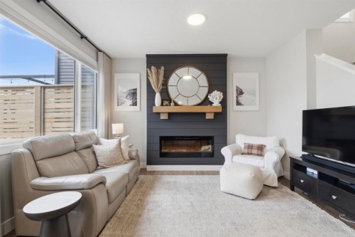 743 Seton Circle Se, Calgary, AB - Indoor Photo Showing Living Room With Fireplace