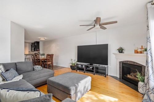 111-323 4 Avenue, Strathmore, AB - Indoor Photo Showing Living Room With Fireplace