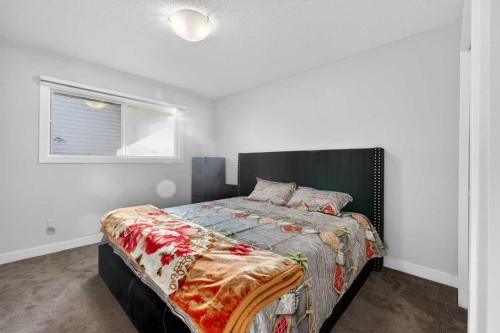8 Malvern Crescent Ne, Calgary, AB - Indoor Photo Showing Bedroom
