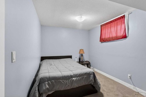 8 Malvern Crescent Ne, Calgary, AB - Indoor Photo Showing Bedroom