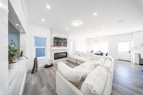 123 Saddlecrest Grove Ne, Calgary, AB - Indoor Photo Showing Living Room With Fireplace