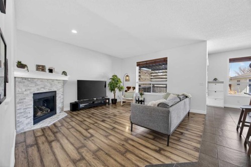 340 Prestwick Terrace Se, Calgary, AB - Indoor Photo Showing Living Room With Fireplace