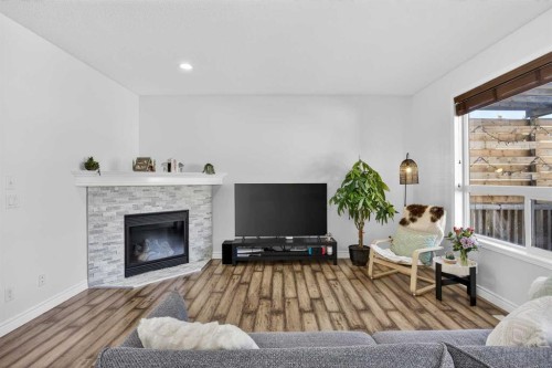 340 Prestwick Terrace Se, Calgary, AB - Indoor Photo Showing Living Room With Fireplace
