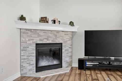 340 Prestwick Terrace Se, Calgary, AB - Indoor Photo Showing Living Room With Fireplace