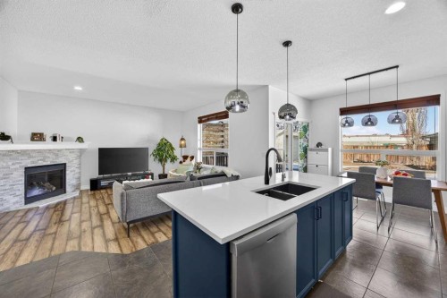 340 Prestwick Terrace Se, Calgary, AB - Indoor Photo Showing Kitchen With Fireplace With Double Sink