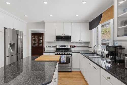 352 Oakside Circle Sw, Calgary, AB - Indoor Photo Showing Kitchen With Double Sink With Upgraded Kitchen
