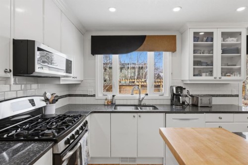 352 Oakside Circle Sw, Calgary, AB - Indoor Photo Showing Kitchen With Double Sink
