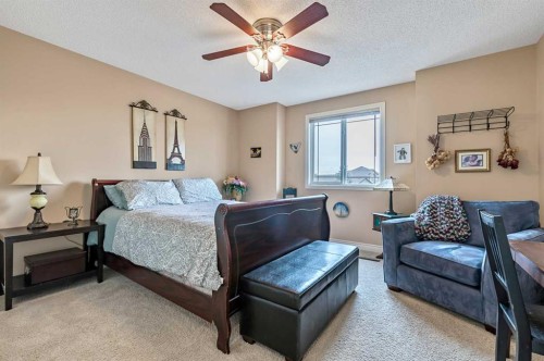 43 Sheep River Heights, Okotoks, AB - Indoor Photo Showing Bedroom