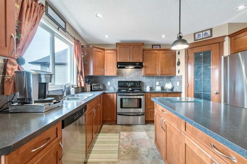 43 Sheep River Heights, Okotoks, AB - Indoor Photo Showing Kitchen With Double Sink
