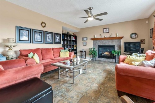 43 Sheep River Heights, Okotoks, AB - Indoor Photo Showing Living Room With Fireplace