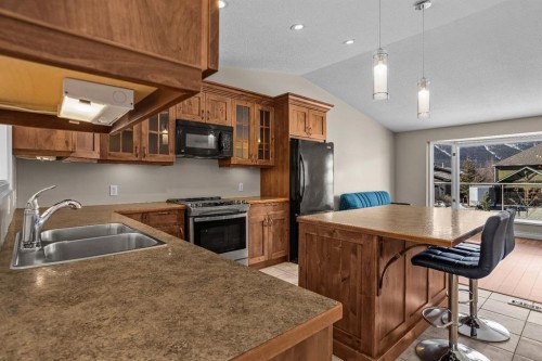 323 Hoodoo Crescent, Canmore, AB - Indoor Photo Showing Kitchen With Double Sink