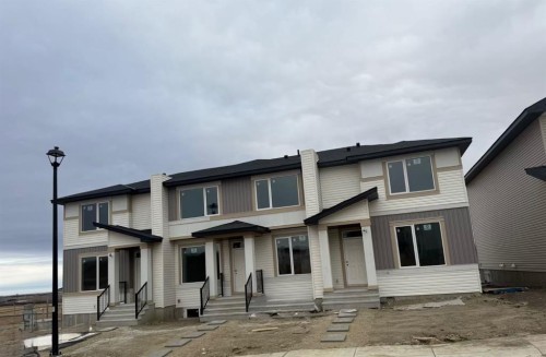1997 Mccaskill Drive, Crossfield, AB - Outdoor With Facade