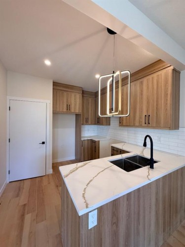 1997 Mccaskill Drive, Crossfield, AB - Indoor Photo Showing Kitchen With Double Sink