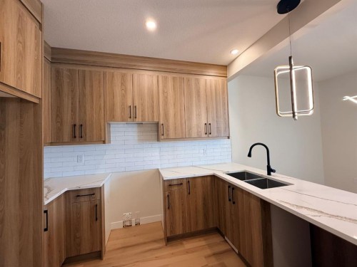 1997 Mccaskill Drive, Crossfield, AB - Indoor Photo Showing Kitchen With Double Sink