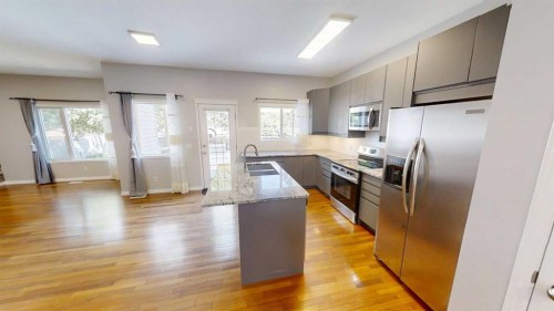 36 Chaparral Drive Se, Calgary, AB - Indoor Photo Showing Kitchen With Double Sink