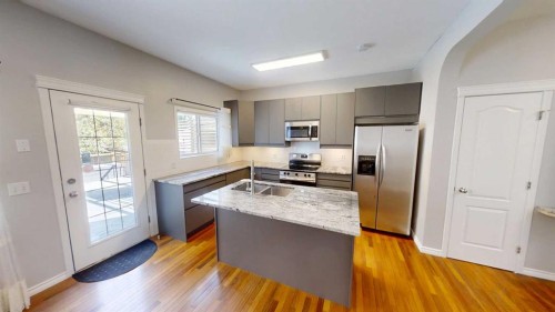 36 Chaparral Drive Se, Calgary, AB - Indoor Photo Showing Kitchen With Double Sink