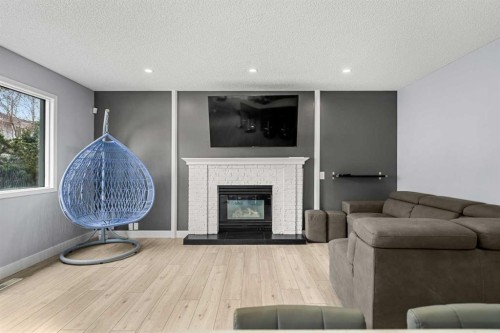 48 Douglas Park Boulevard Se, Calgary, AB - Indoor Photo Showing Living Room With Fireplace