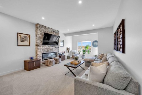 13 Emerson Crescent, Okotoks, AB - Indoor Photo Showing Living Room With Fireplace